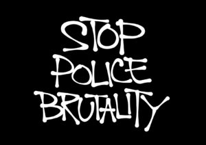 Stop police brutality written in white chalkboard marker on a black chalkboard to stop Delaware County police misconduct.